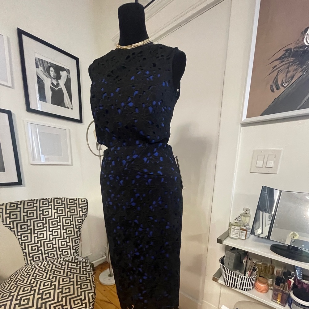 Lovely lace cocktail dress with cut out sides